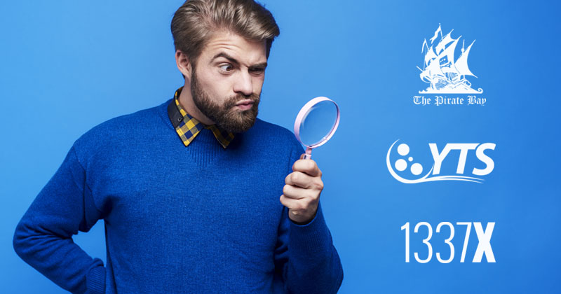 man looking through a magnifying glass at kickass torrents alternatives