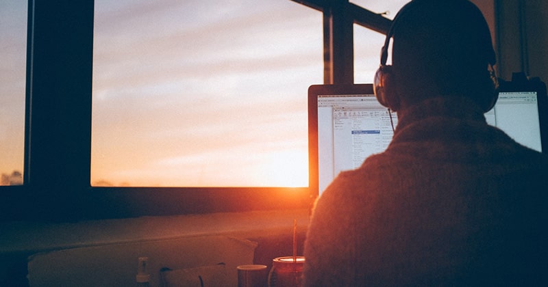 Man working with the laptop in the evening